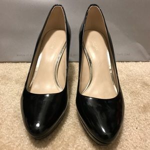Coach patent leather pumps.